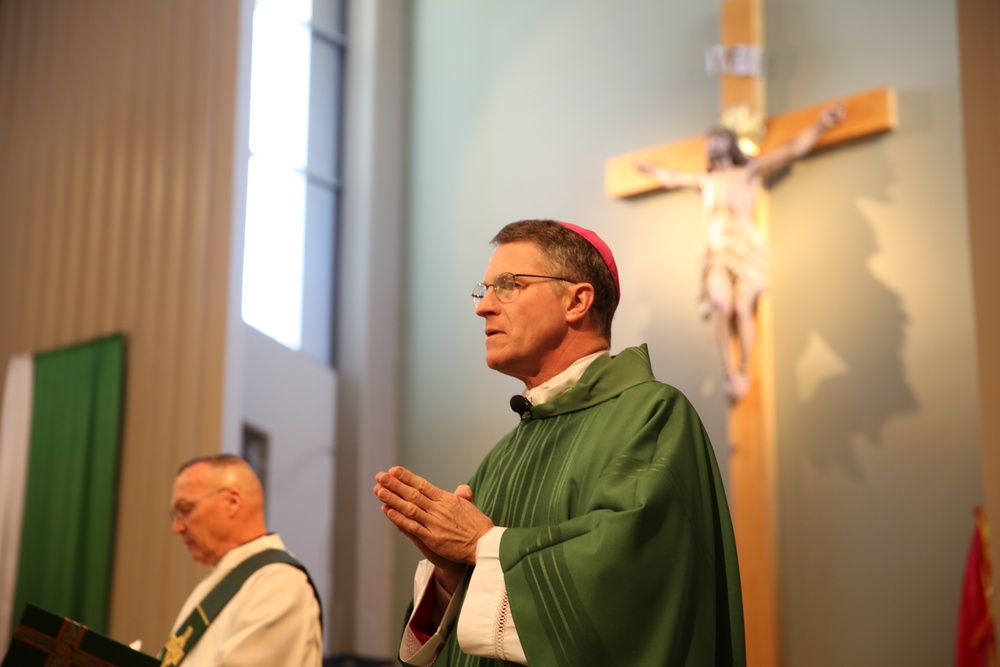 Archbishop conducts Mass at Combat Center