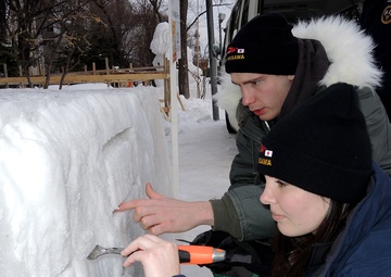 2014 Navy Misawa Snow Team completes 'Fighting Bee' snow sculpture