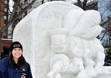 2014 Navy Misawa Snow Team completes 'Fighting Bee' snow sculpture