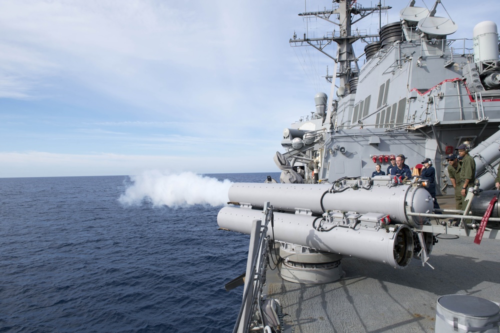 Sailors fire an air slug