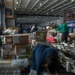 USS Harry S. Truman service members sort mail