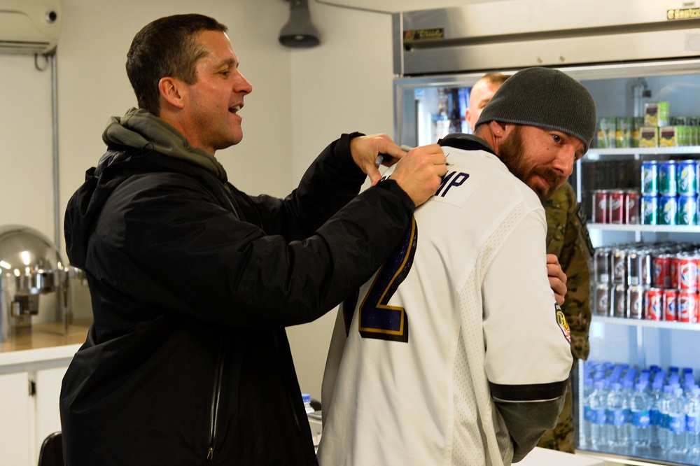 Baltimore Ravens head coach visits service members