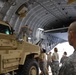 Command Sgt. Maj. Barja of the 371st Sus. Bde. tours cargo operations in Southwest Asia.