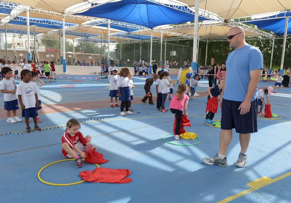 Airman, soldiers share in &quot;Sports Day&quot; with local children