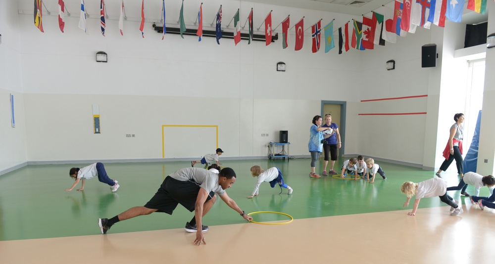 Airman, soldiers share in &quot;Sports Day&quot; with local children