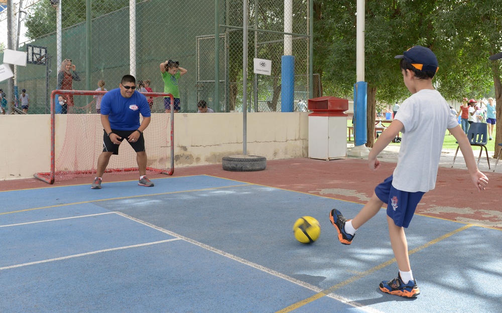 Airman, soldiers share in &quot;Sports Day&quot; with local children