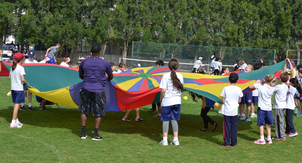 Airman, soldiers share in &quot;Sports Day&quot; with local children