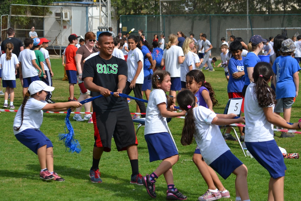 Airman, soldiers share in &quot;Sports Day&quot; with local children