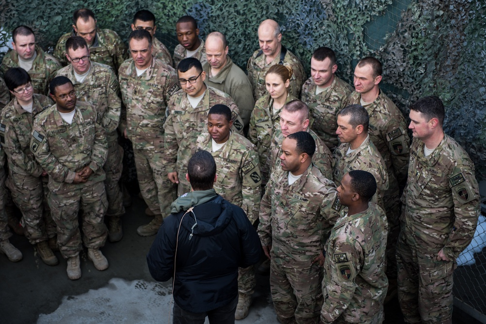 Ravens head coach John Harbaugh visits with troops in Afghanistan