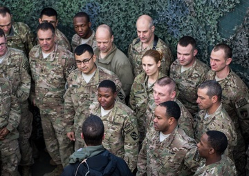 Ravens head coach John Harbaugh visits with troops in Afghanistan