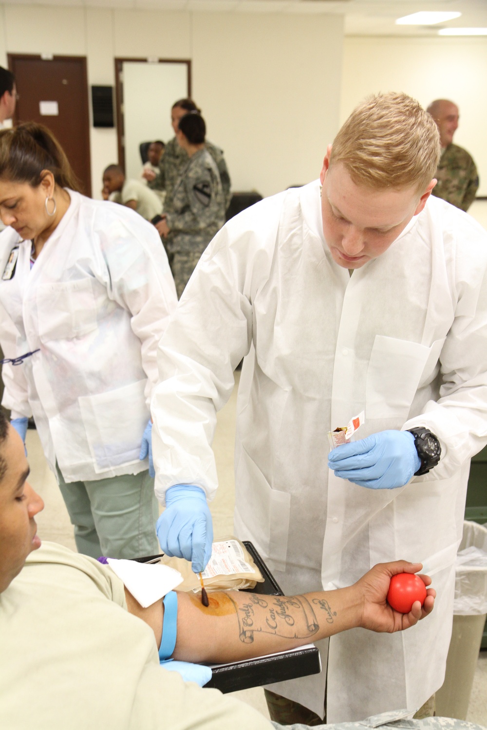Blood specialist preps a patient for a phlebotomy