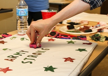 Families decorate pillows for deployed 2 Fury paratroopers