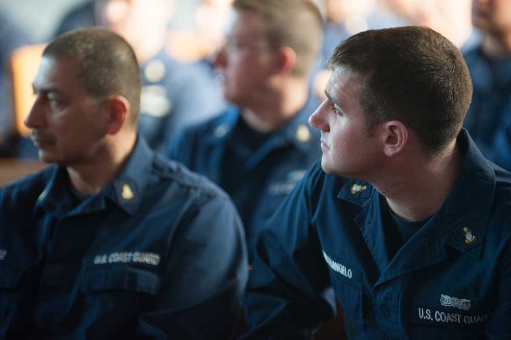 Coast Guardsmen listen to Shipmate