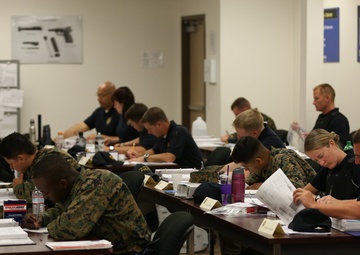 Military police work alongside civilian police aboard air station