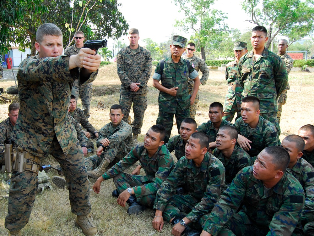 US Marines train with Royal Thai Marines on pistol techniques