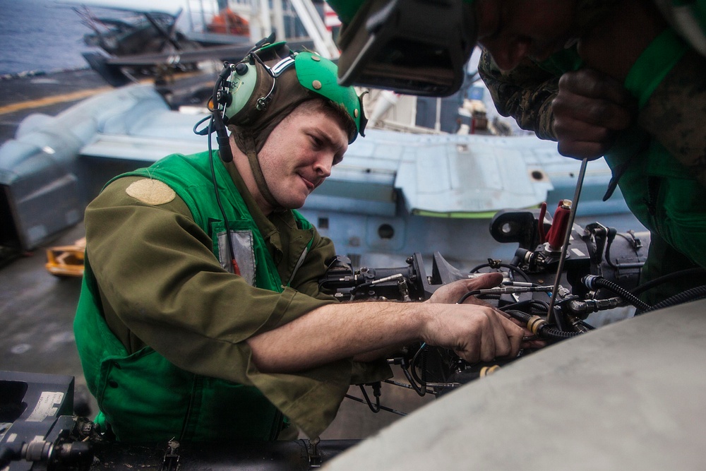 VMM-263 Marines maintain aircraft on USS Bataan flight deck