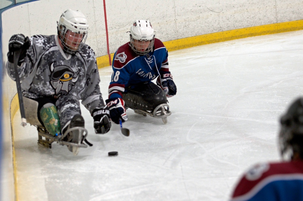 Athletes race for the puck