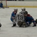 Players collide to take the puck