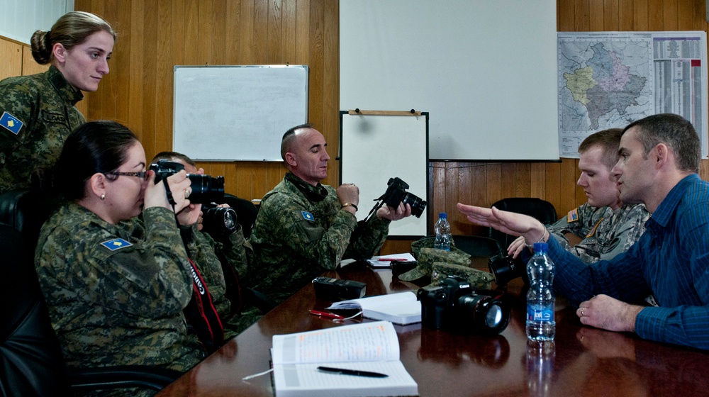 MNBG-E public affairs soldiers educate multinational counterparts in photography