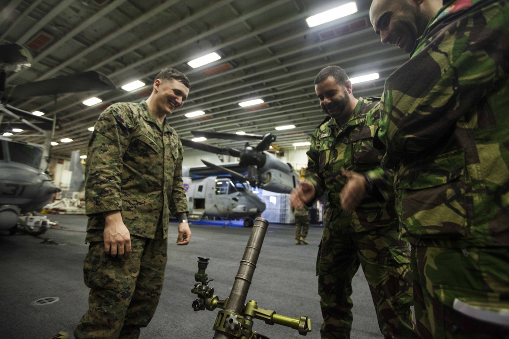 Marine laughs with Portuguese navy sailors