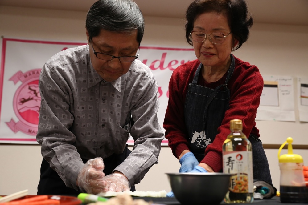 Spouses make sushi, build camaraderie
