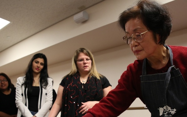 Spouses make sushi, build camaraderie