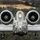 A head-on close-up photograph of an A-10 Thunderbolt II (Warthog) attack aircraft in flight. The aircraft features distinctive nose art depicting a bulldog or similar aggressive animal face, with the number '188' visible on both sides. The twin turbofan engines mounted above the fuselage are clearly visible, along with the GAU-8 Avenger rotary cannon barrel protruding from the nose.