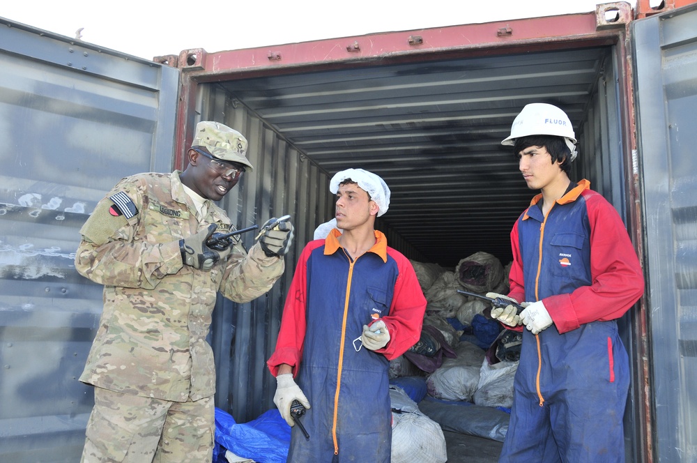 Pfc. Anthony Lodiong instructs local workers