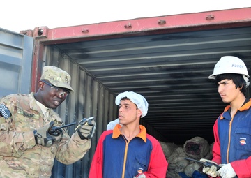 Pfc. Anthony Lodiong instructs local workers