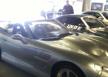 Airmen race cars on millionaire's track