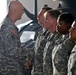 Odierno presents coins to soldiers