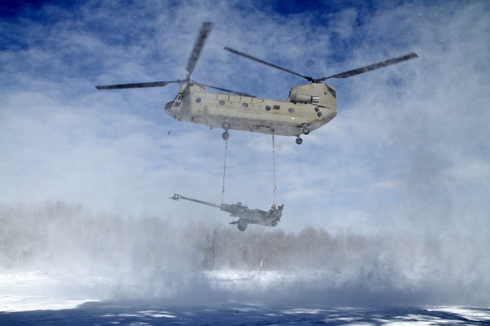 Michigan National Guard conducts cold weather sling load and howitzer live fire exercise