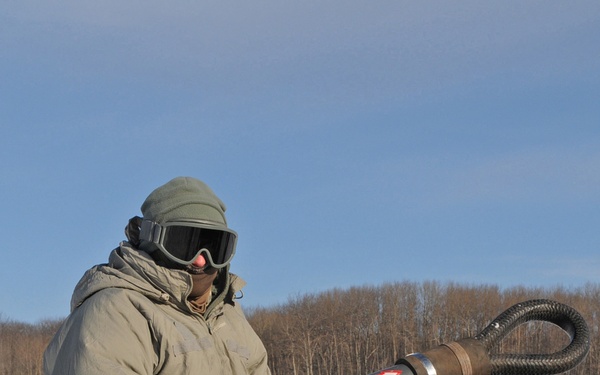 Michigan National Guard conducts cold weather sling load and howitzer live fire exercise