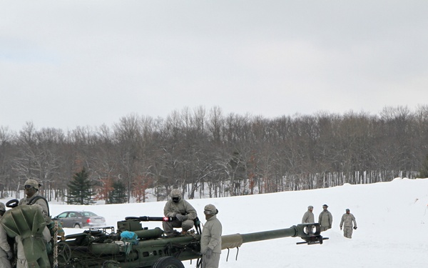 Michigan National Guard conducts cold weather sling load and howitzer live fire exercise