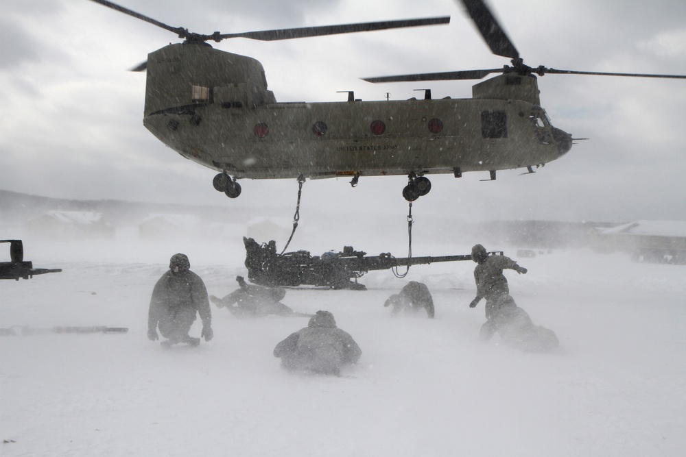 Michigan National Guard conducts cold weather sling load and howitzer live fire exercise