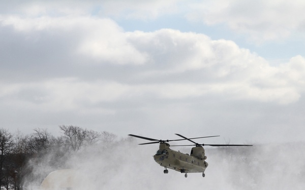 Michigan National Guard conducts cold weather sling load and howitzer live fire exercise