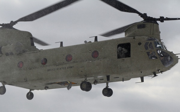 Michigan National Guard conducts cold weather sling load and howitzer live fire exercise