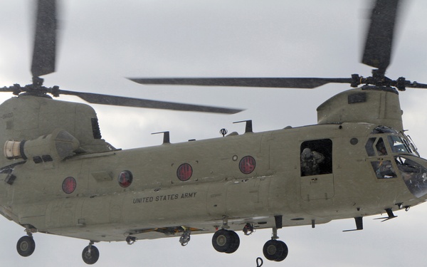 Michigan National Guard conducts cold weather sling load and howitzer live fire exercise
