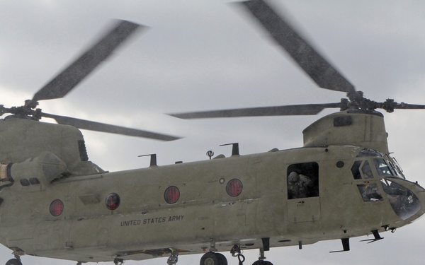 Michigan National Guard conducts cold weather sling load and howitzer live fire exercise