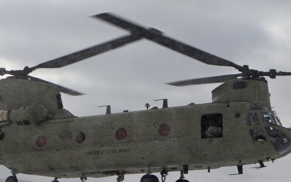Michigan National Guard conducts cold weather sling load and howitzer live fire exercise