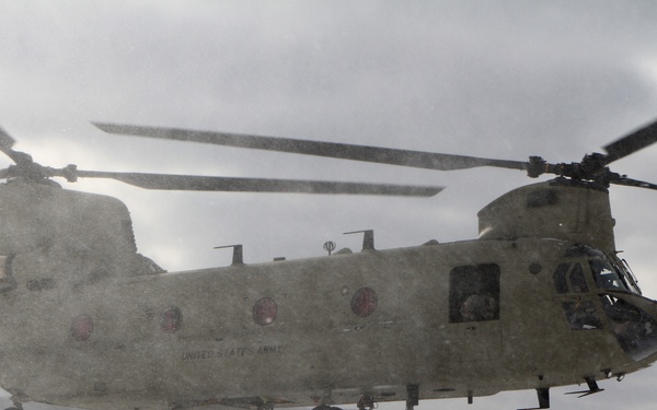 Michigan National Guard conducts cold weather sling load and howitzer live fire exercise