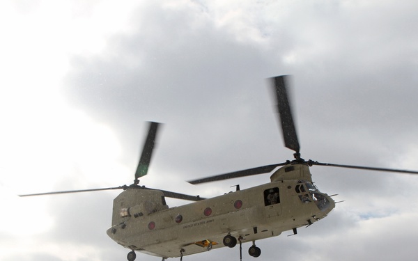 Michigan National Guard conducts cold weather sling load and howitzer live fire exercise