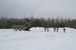 Michigan National Guard conducts cold weather sling load and howitzer live fire exercise