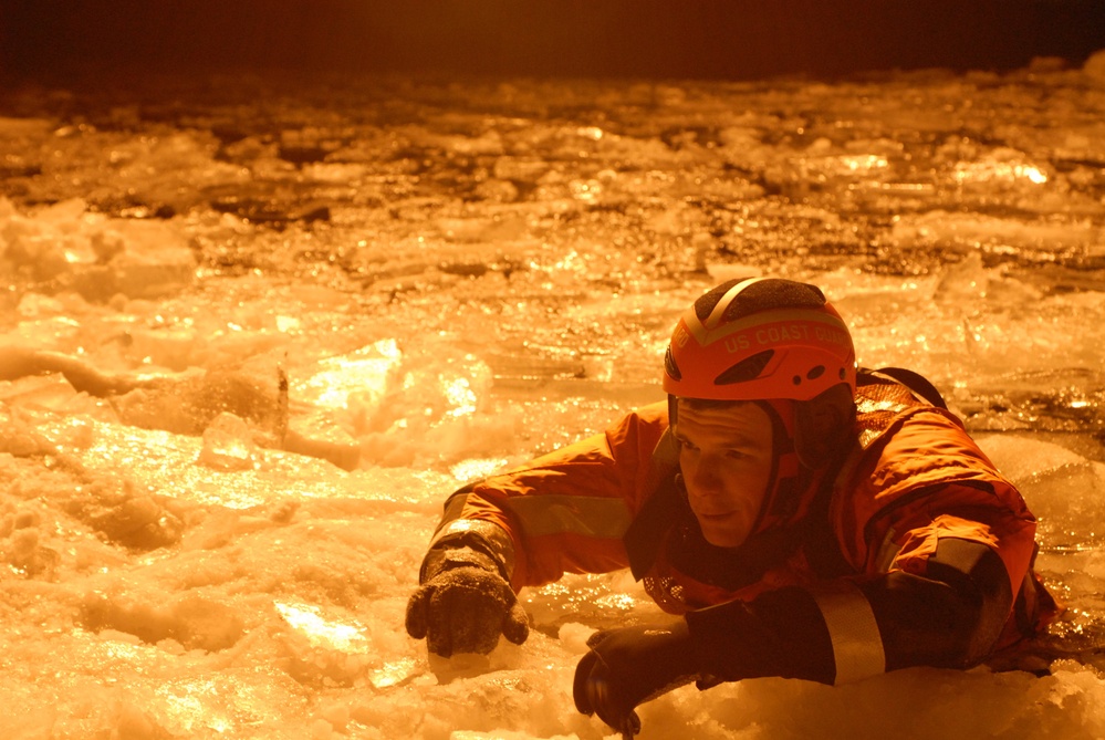 Hollyhock crew member in ice during ice rescue training