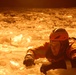 Hollyhock crew member in ice during ice rescue training