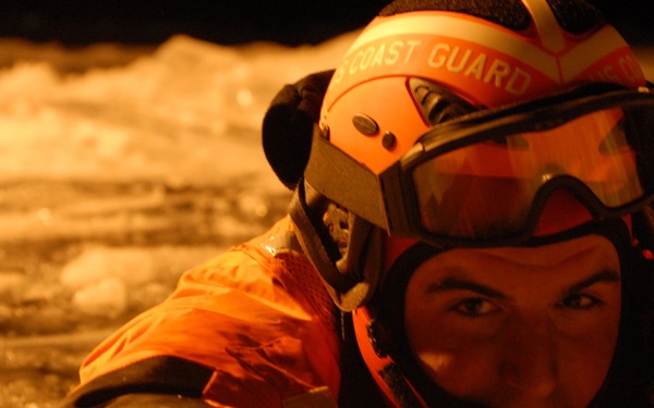 Hollyhock crew member in ice during ice rescue drills