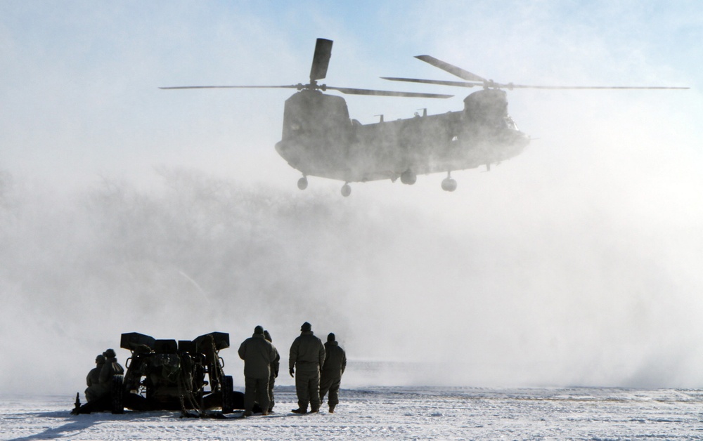 Michigan National Guard conducts cold weather sling load and howitzer live-fire exercise