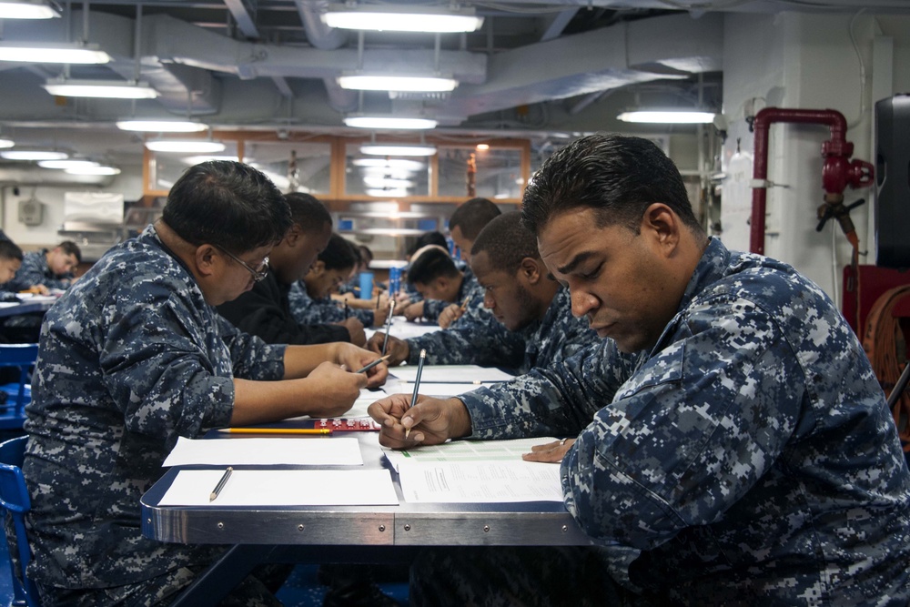 USS Peleliu sailors take E6 Advancement Exam