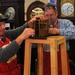 Clocksmiths repair a grandfather clock