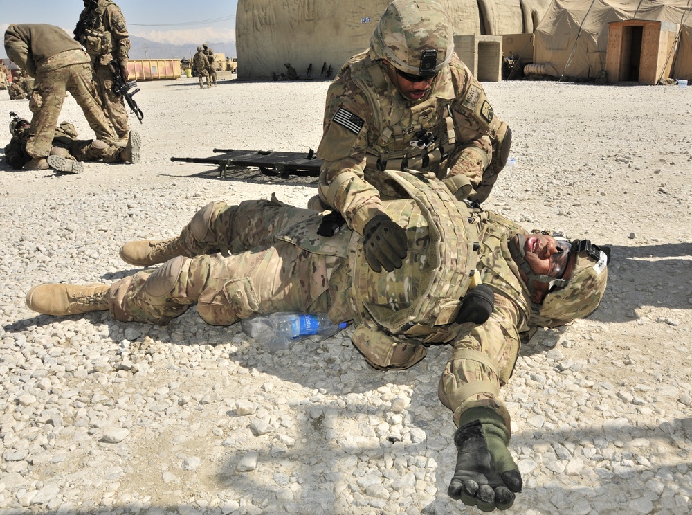 Soldier assesses casualty during CLS refresher course